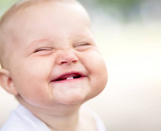 Infant smiles